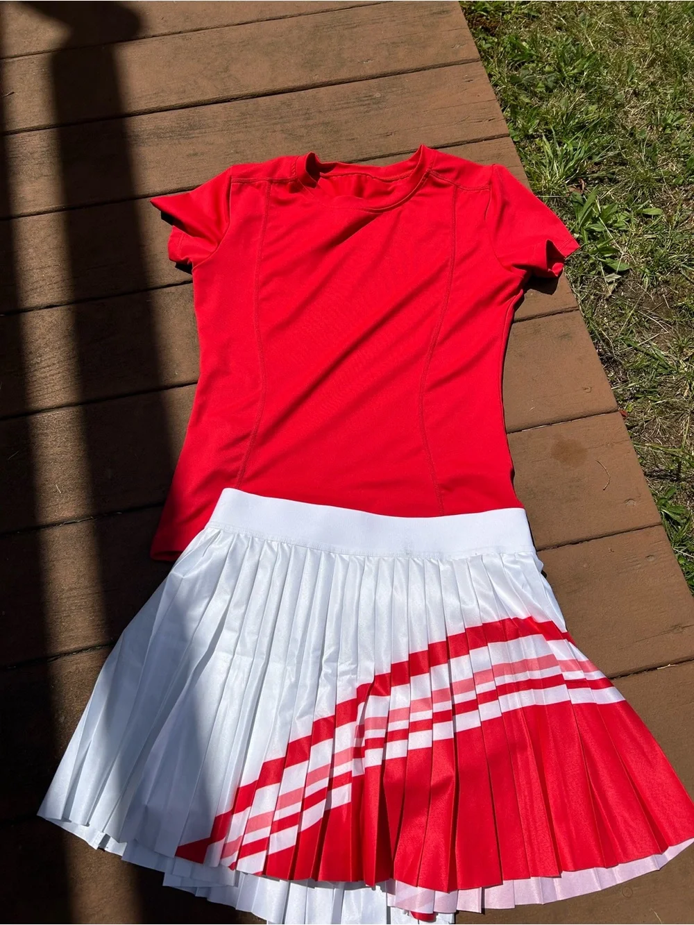 Red Athletic Shirt with White Pleated Athleta Skirt